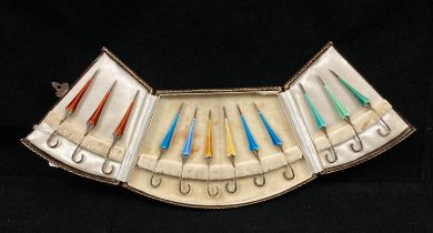 A cased set of twelve silver hallmarked and guilloche enamel novelty cocktail sticks by A Bros Ltd