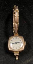 9ct gold (375) cased lady's watch with a 9ct gold sprung-strap (watch working).