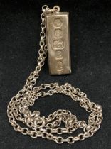 Silver hallmarked ingot with a 22" sterling silver chain - total approximate weight 1.