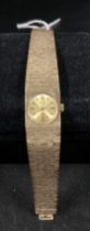 9ct gold (375) lady's Accurist watch in bark finish. Total weight - 37.