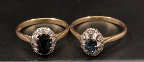 22ct gold sapphire and diamond ring - oval sapphire surrounded with small diamond (both stones