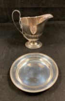 Silver hallmarked jug (dated 1896, Sheffield) and a silver hallmarked small dish (dated 1977,