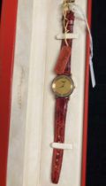 S T Dupont Paris lady's wrist watch with red leather strap and gold plated buckle - ref: 23289/199.