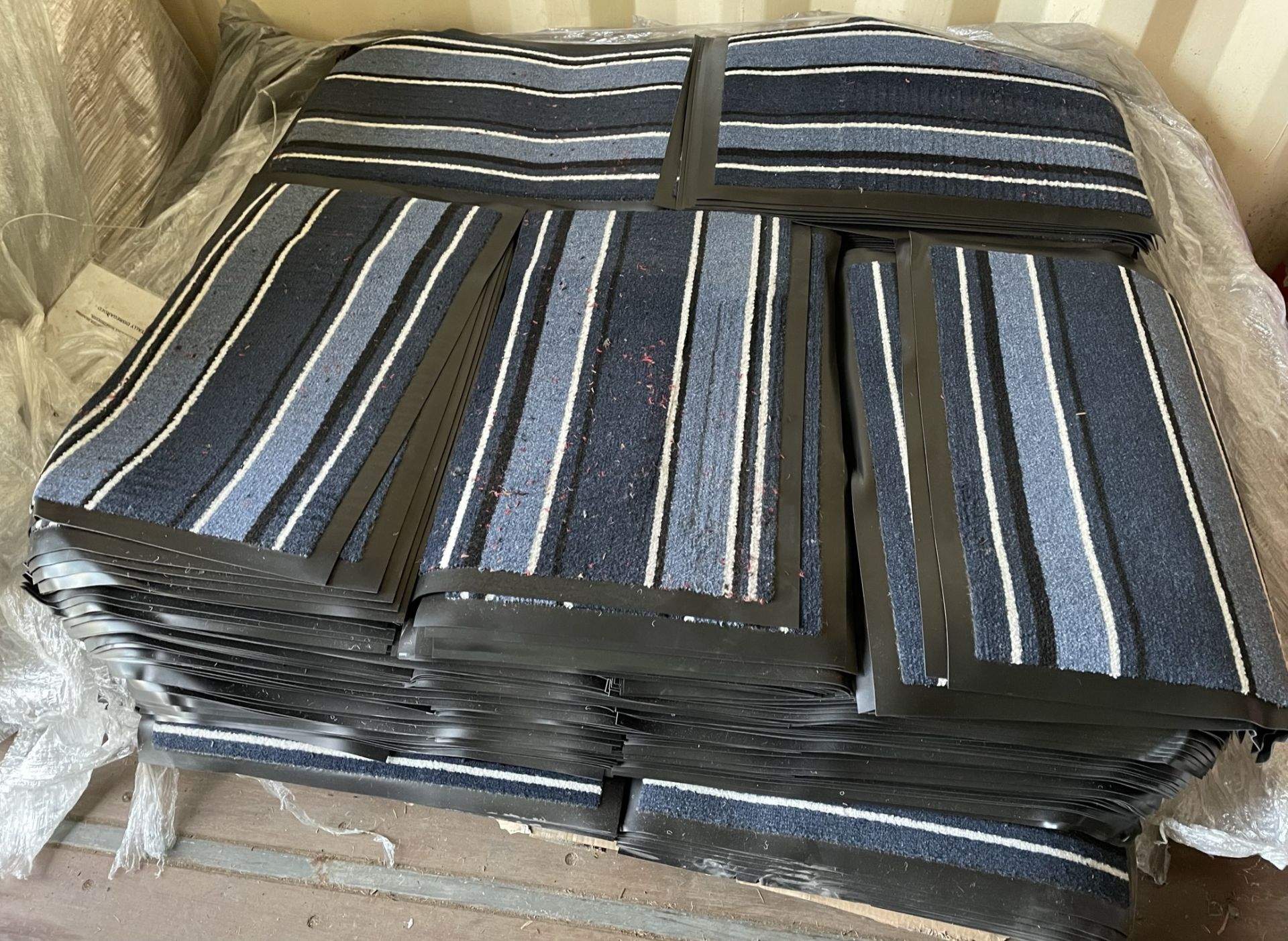 Contents to half pallet - approximately 450 blue striped rubber backed door mats approx. - Image 2 of 2