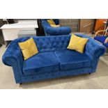 Blue upholstered button-backed Chesterfield style 2-seater sofa complete with cushions (saleroom