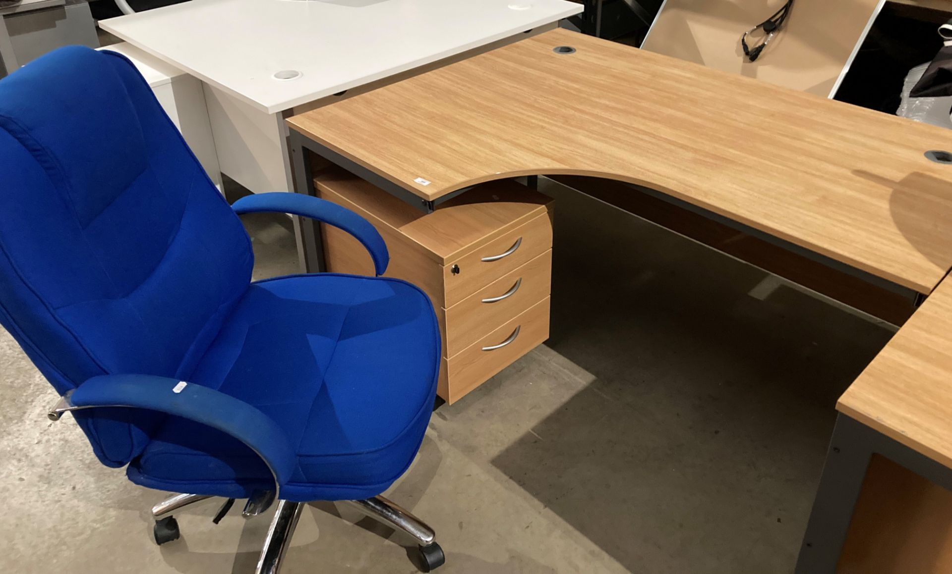 Metal-framed curved office desk c/w blue high-back swivel office armchair and three-drawer pedestal
