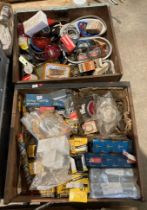 Contents to two wooden drawers - assorted car parts including oil filters, lenses, bulbs, wiring,