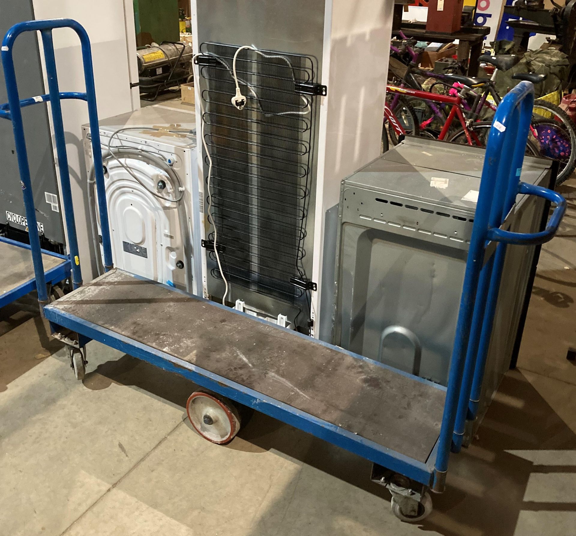Thin blue metal mobile stock trolley,