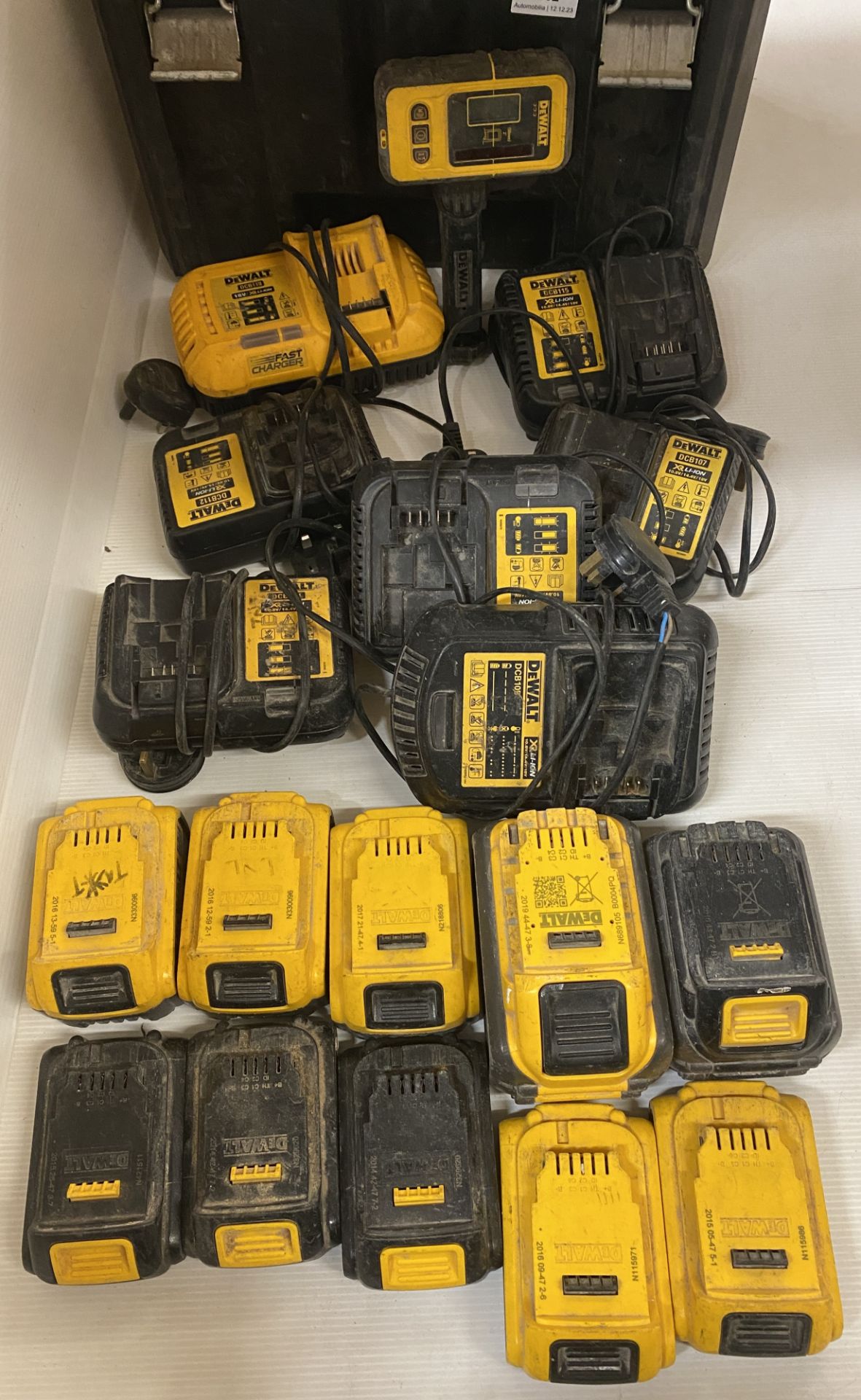 Contents to case - 6 x DeWalt battery chargers and 10 x assorted batteries (sold as seen) (saleroom - Image 2 of 2