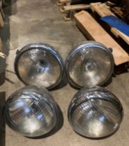 A pair of Lucas MB166 vintage headlights and a matching pair of Lucas MB148 headlights (saleroom