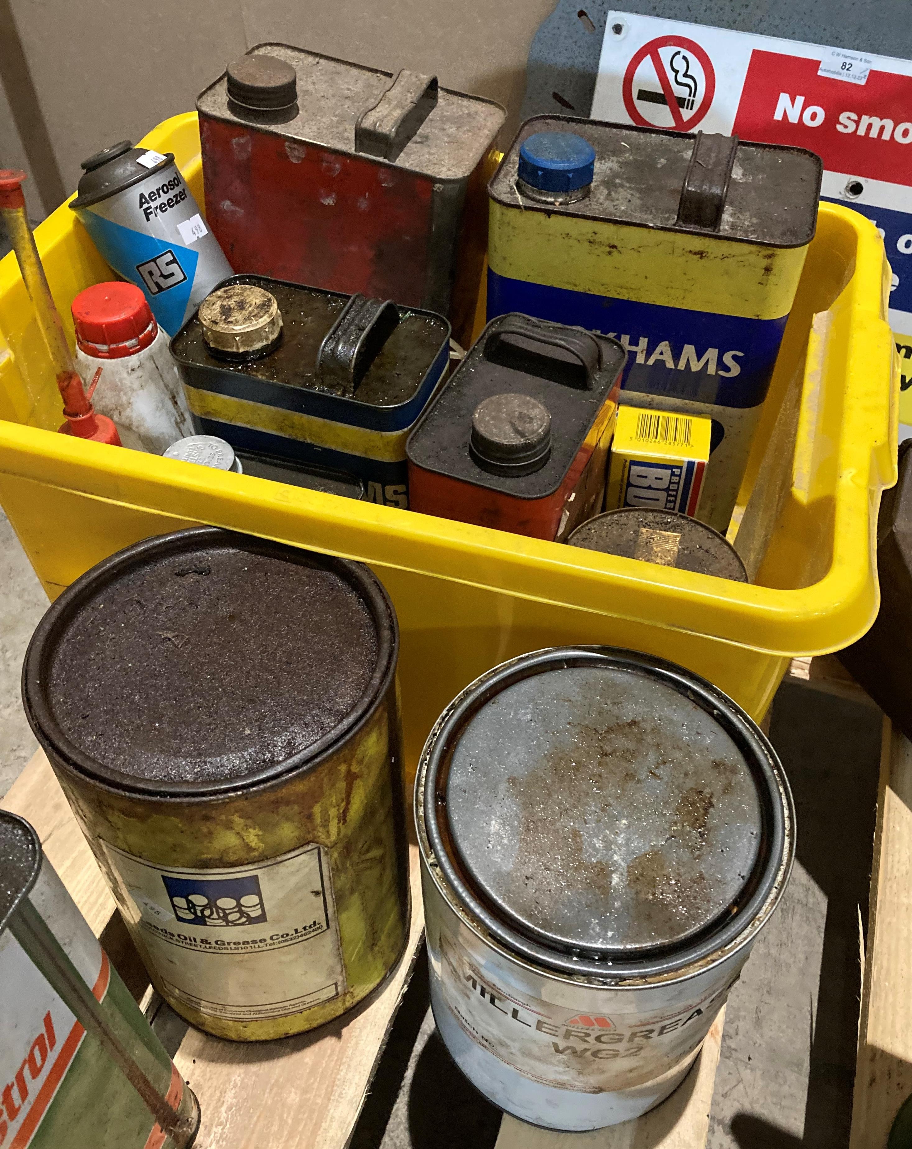 Contents to yellow tub - assorted Duckhams and Castrol oil cans (some with contents),