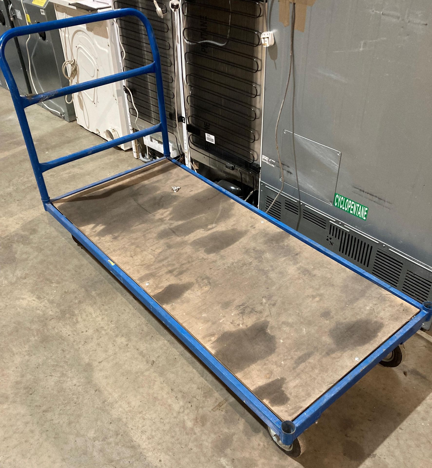 Blue metal-framed four-wheel mobile stock trolley - size of bed: 150 x 69cm (saleroom location: