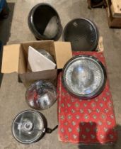 A pair of boxed Lucas 700 headlamps type 140 possible used,