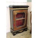 A late 19th Century French boulle cabinet with ebonised top,