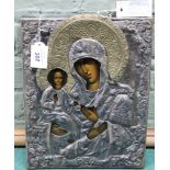 A Polish white metal cased religious icon of the Madonna and China,