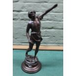 An antique bronze statue, the figure with raised arm and hammers and tools at his feet,