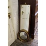 A 20th Century rectangular bevelled glass wall mirror and a Regency style convex mirror