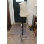 A wrought iron standard lamp