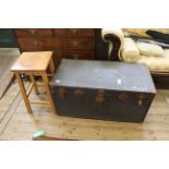 A metal clad travelling trunk and a beech high stool