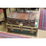 A leather suitcase and a travelling trunk