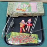 A vintage 'Bestmaid Mechanical Marionette Theatre' Japanese made tin plate with celluloid figures