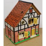 A vintage wooden and board constructed dolls house,