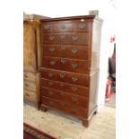 A George III mahogany chest on chest with fluted canted sides to upper section and fitted
