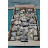 A large collection of Lilliput Lane etc cottages and buildings