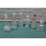 Six mainly molded glass decanters including one blown example