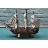 Vintage wooden model of HMS Victory in full sail,