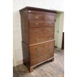 A late 18th Century mahogany chest on chest with dentil cornice and offset bracket feet.