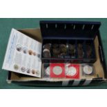 A cash tin containing mixed world coins and British,