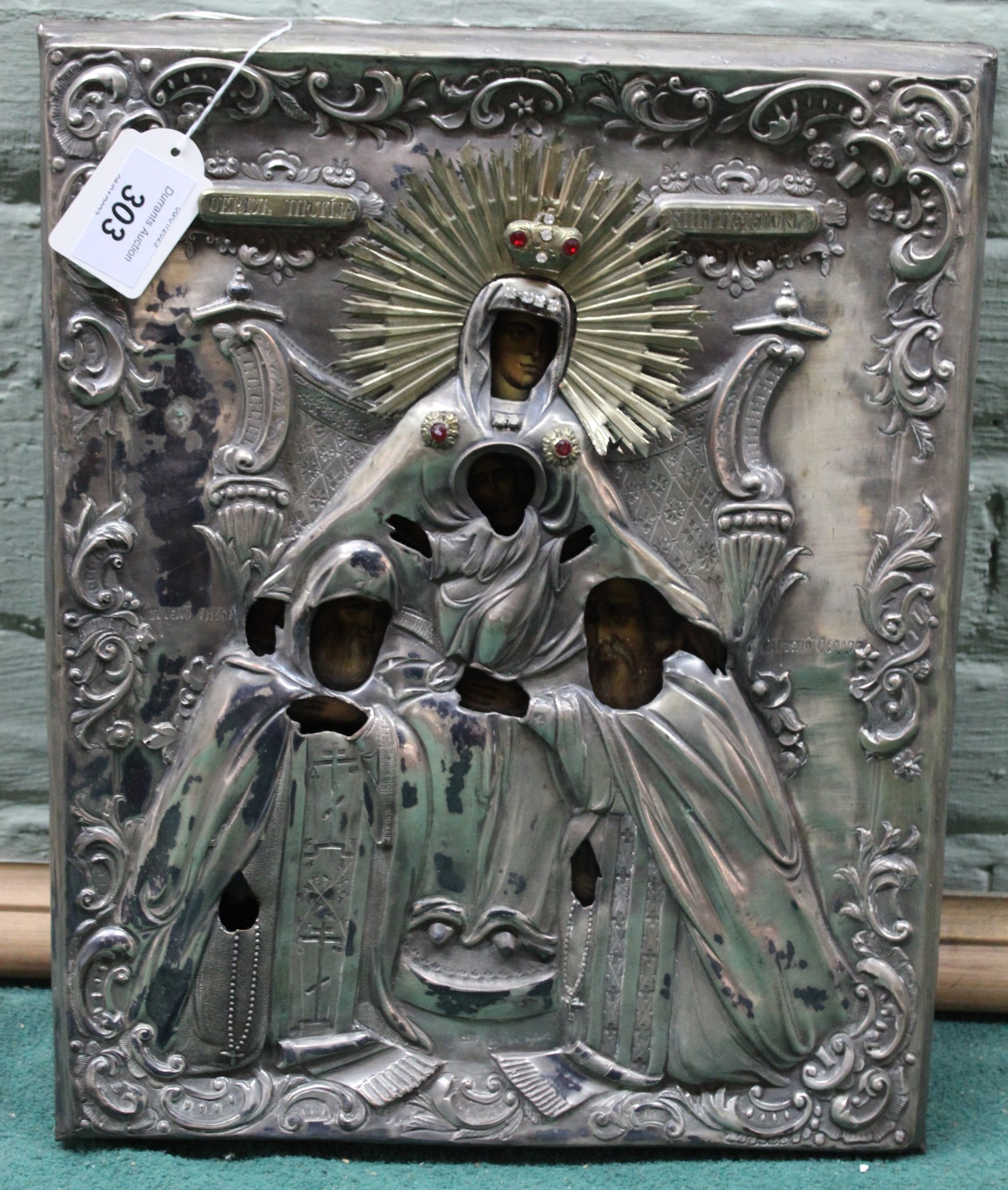 A white metal cased religious icon of apostles and Madonna and Child, label for Polish origin, 28.