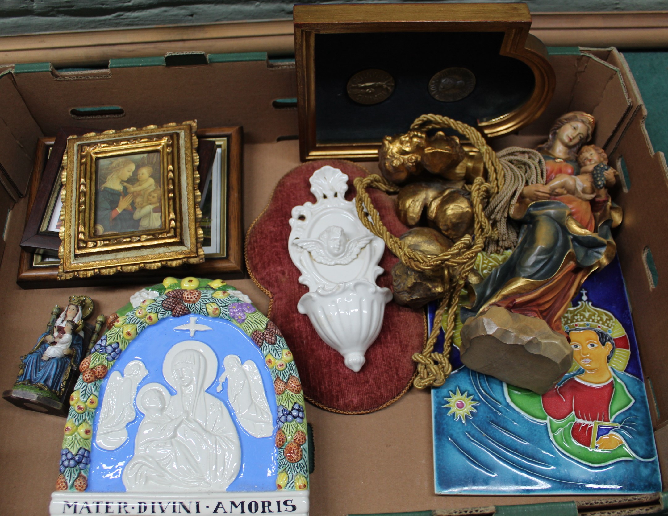 A selection of religious ornaments and plaques including carved figure of Madonna and child etc