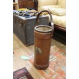 A leather stick stand converted from Naval cordite container with brass rim,