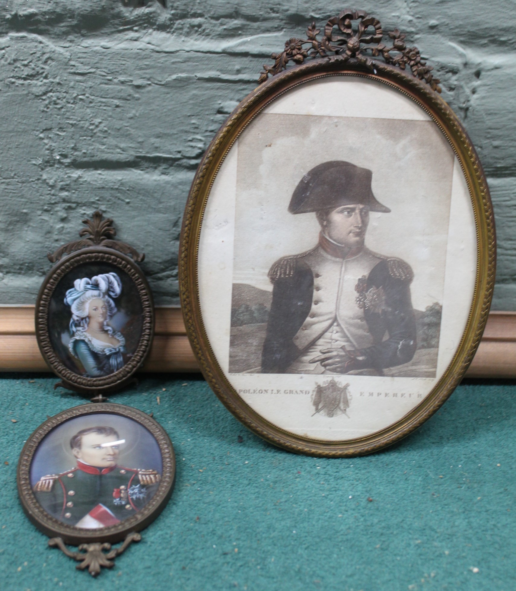 A framed print of Napoleon Le Grand Empereur plus two joined picture miniatures of Napoleon and