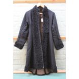 A late Victorian/Edwardian astrakhan ladies coat with wool trim, small size, the inside lined,
