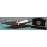 A scratch built wooden model ships hull plus a large black slate mantel clock