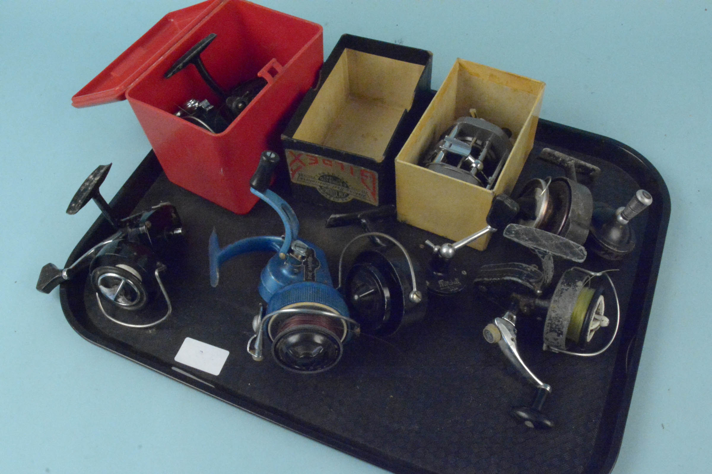 Six early fixed spool reels and a Gildex boxed multiplier reel (handle as found)