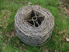 Roll of barbed wire and straining wire