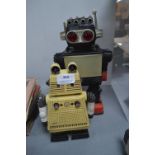 Two Toy Battery Powered Robots
