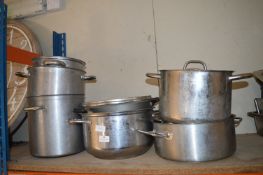 Seven Stainless Steel Cooking Pots Some with Lids