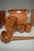 Terracotta Pot, Six Mugs, and a Spoon