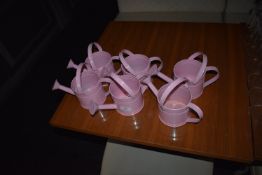 *Six Small Pink Watering Cans