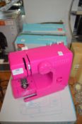 Three Argos Mini Pink Sewing Machines