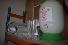 Quantity of Plastic Cups, Spray, and Plastic Bags