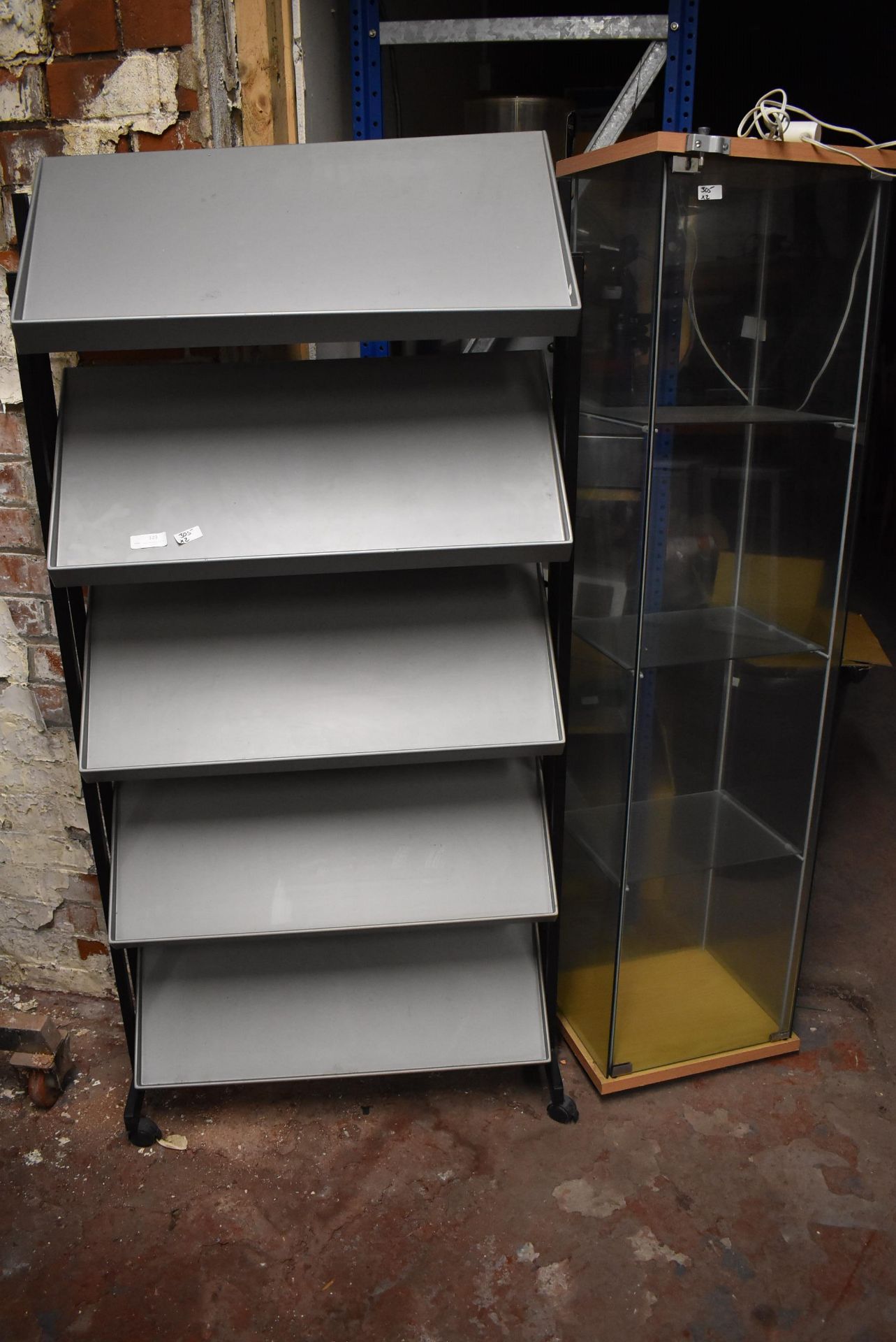 *Plastic Newspaper Rack and a Glass Display Unit