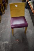 Four Wood Chairs with Purple Upholstered Seats