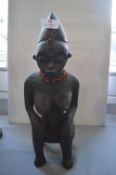 Seated Female Tribal Figure with Bead Necklace