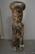 Balue Carved Wooden Seated Male Figure with Bead Decoration